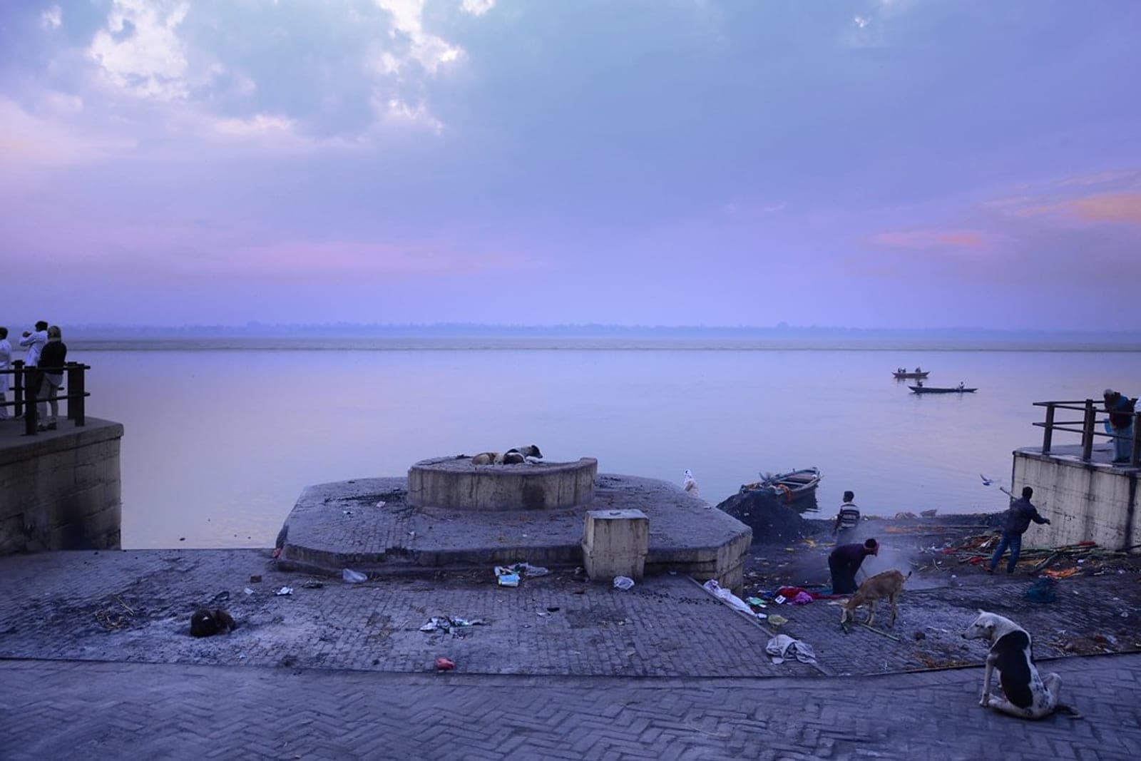 Boats and steps at a Ganga ghat in early morning light